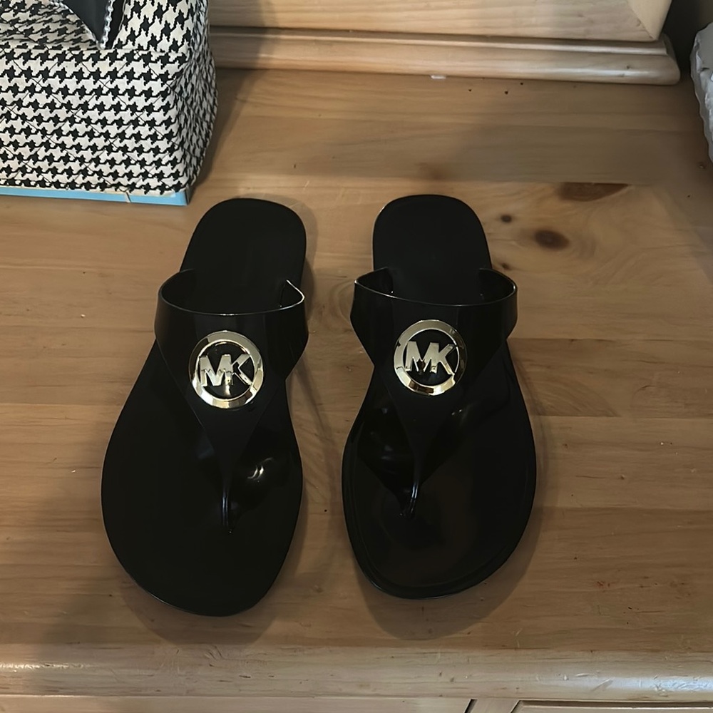 Michael Kors Black Flip Flops with Gold Emblem